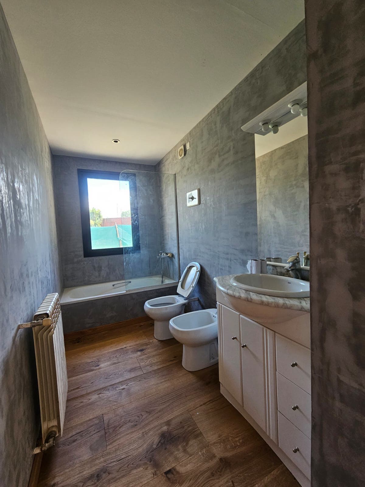 Hardwood — Bathroom with polished cement walls