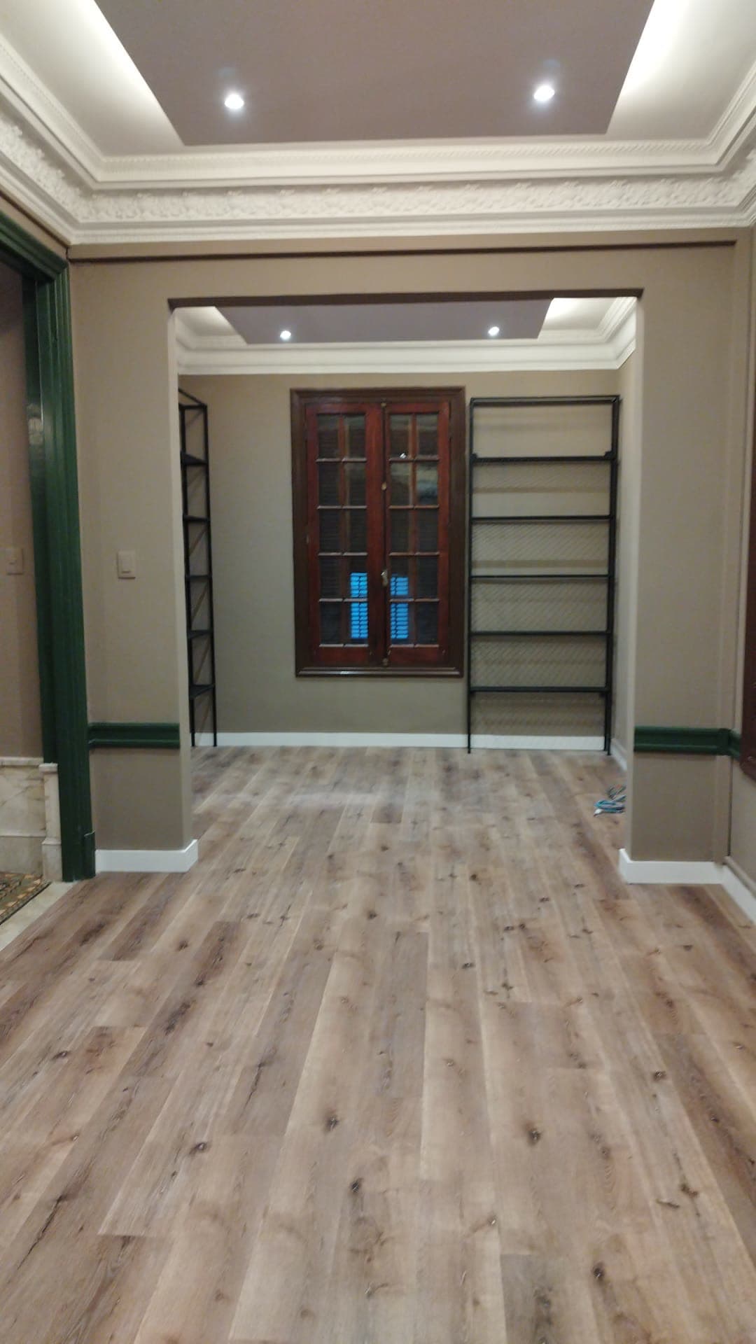Nora Rey Boutique — Enfilade of rooms with the restored mouldings